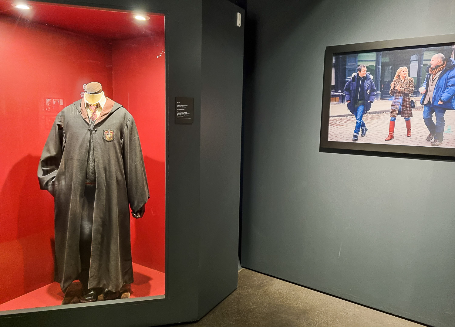 Harry Potter's robes and a behind the scenes photo from filming at the start of London's Harry Potter Photo Exhibition in Covent Garden