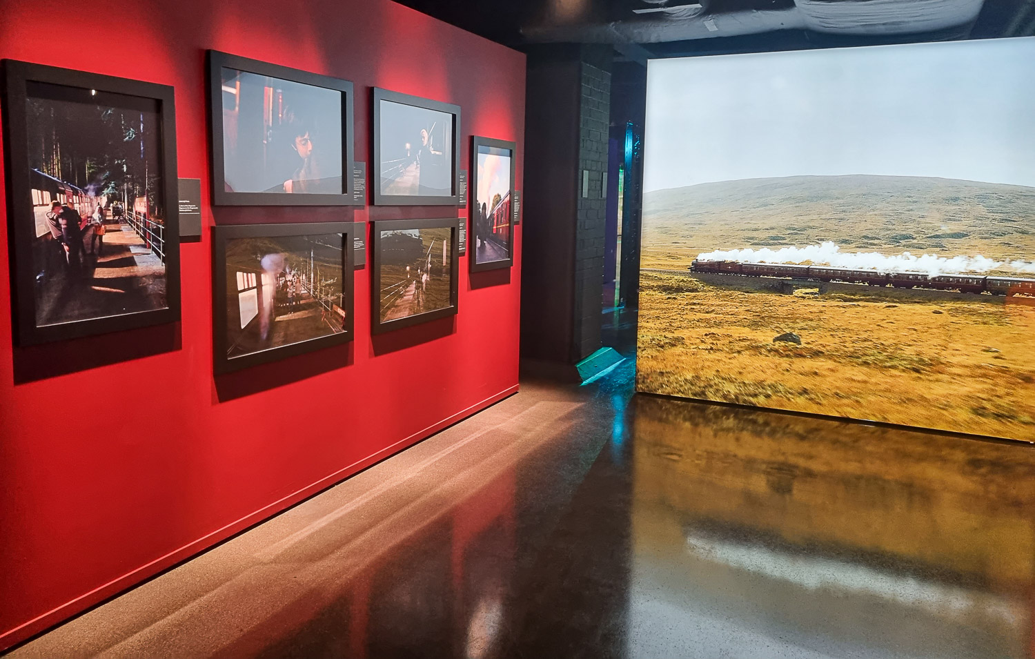 View of the Hogwarts Express steam train and other photos from the movies at the Harry Potter Photographic Exhibition in Covent Garden, London