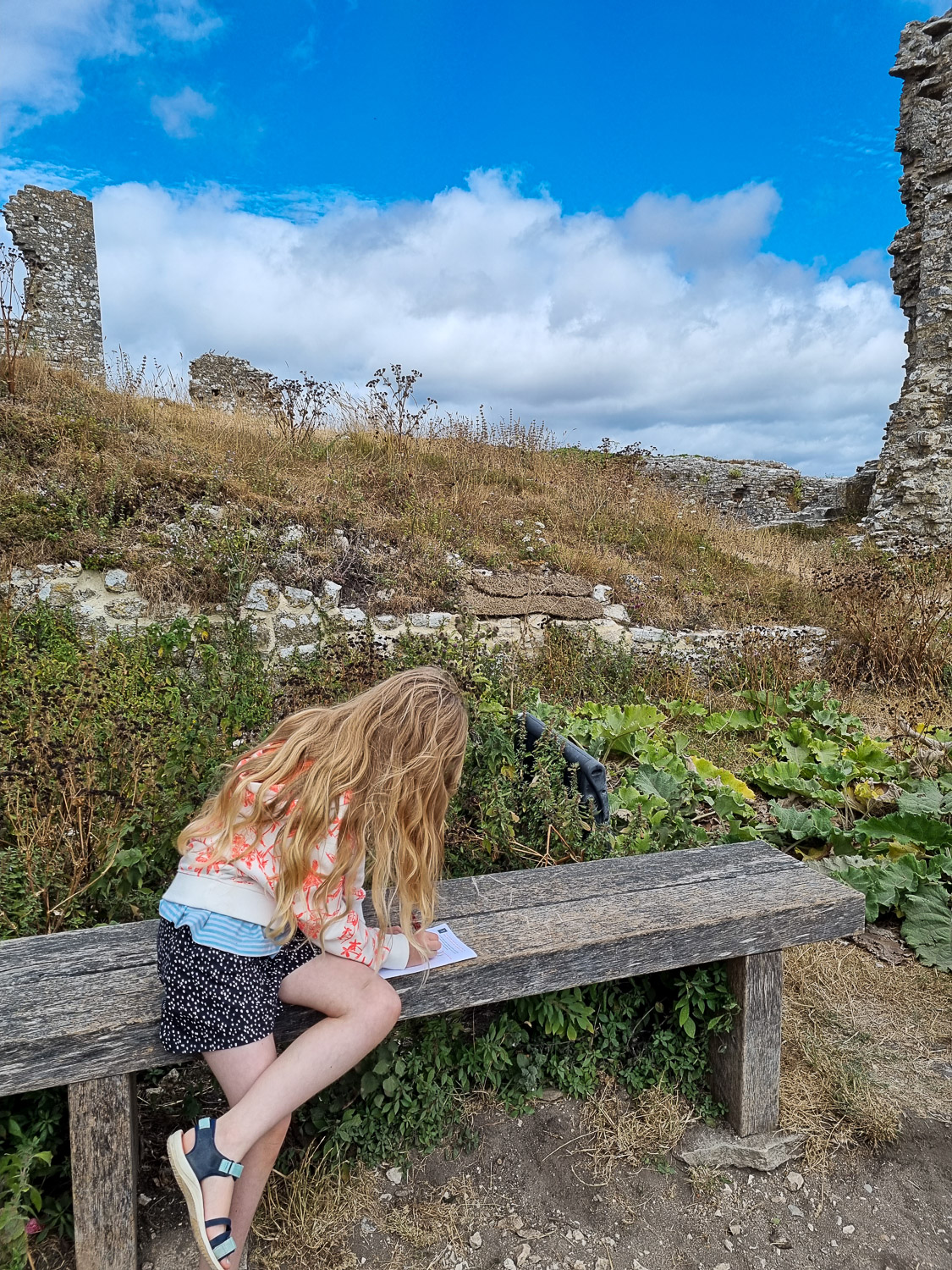 My daughter completes the Corfe Castle trail for kids during a day out in Dorset