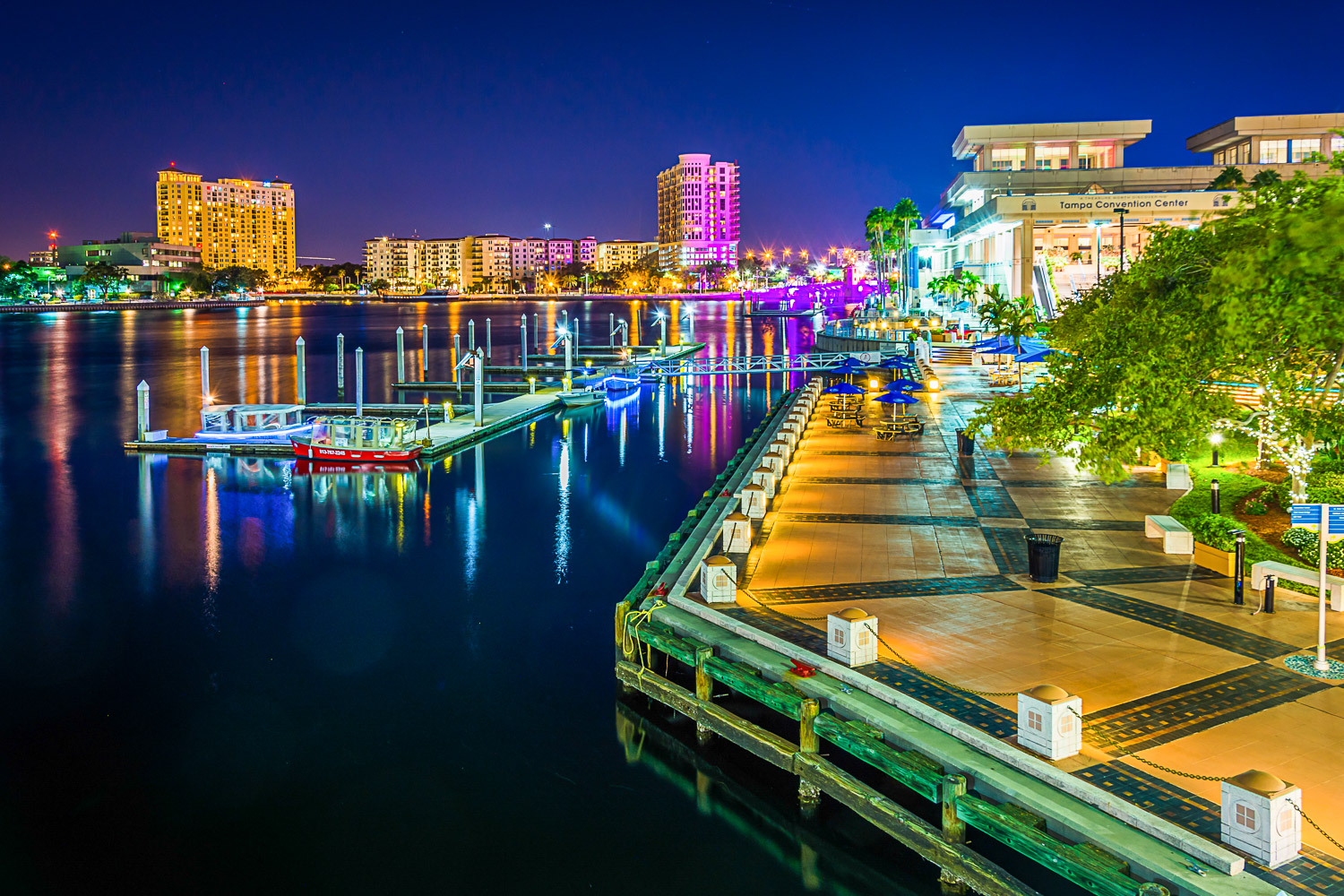 View of the Riverwalk at night in Tampa, Florida - talking a walk along here is one of the best things to do in Tampa with kids