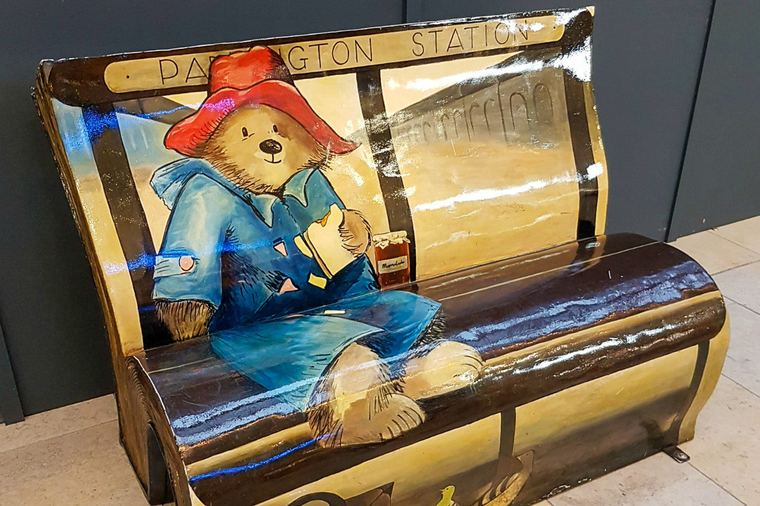 The Paddington bear bench at Paddington station - if you're hoping to find Paddington Bear in London, the station is the best place to start your own Paddington bear trail in London