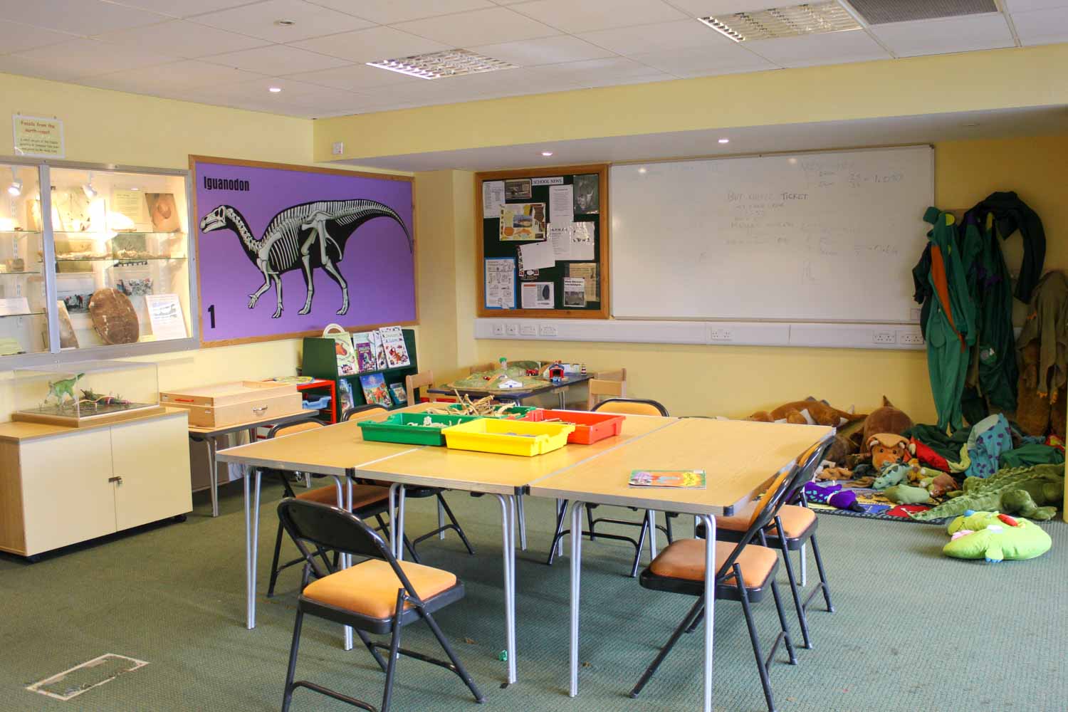 Soft toys around a table with activities for children and schools in the Education room at Dinosaur Isle, on the Isle of Wight