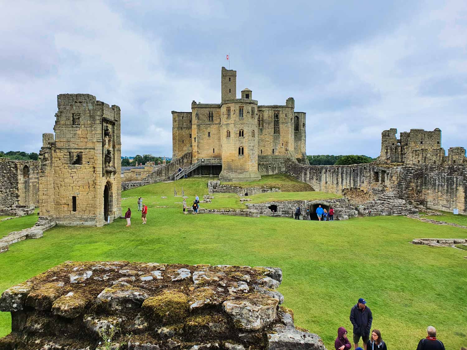 View from one of the ruined towers across the inner court to the keep at Warkworth Castle Northumberland - our review of a day out with kids