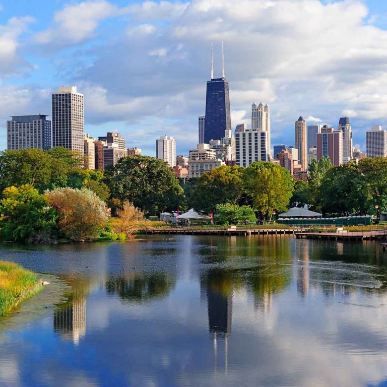 View of the Chicago skyline and its skyscrapers when viewed from Lincoln park across the lake - my top things to do in Chicago with kids