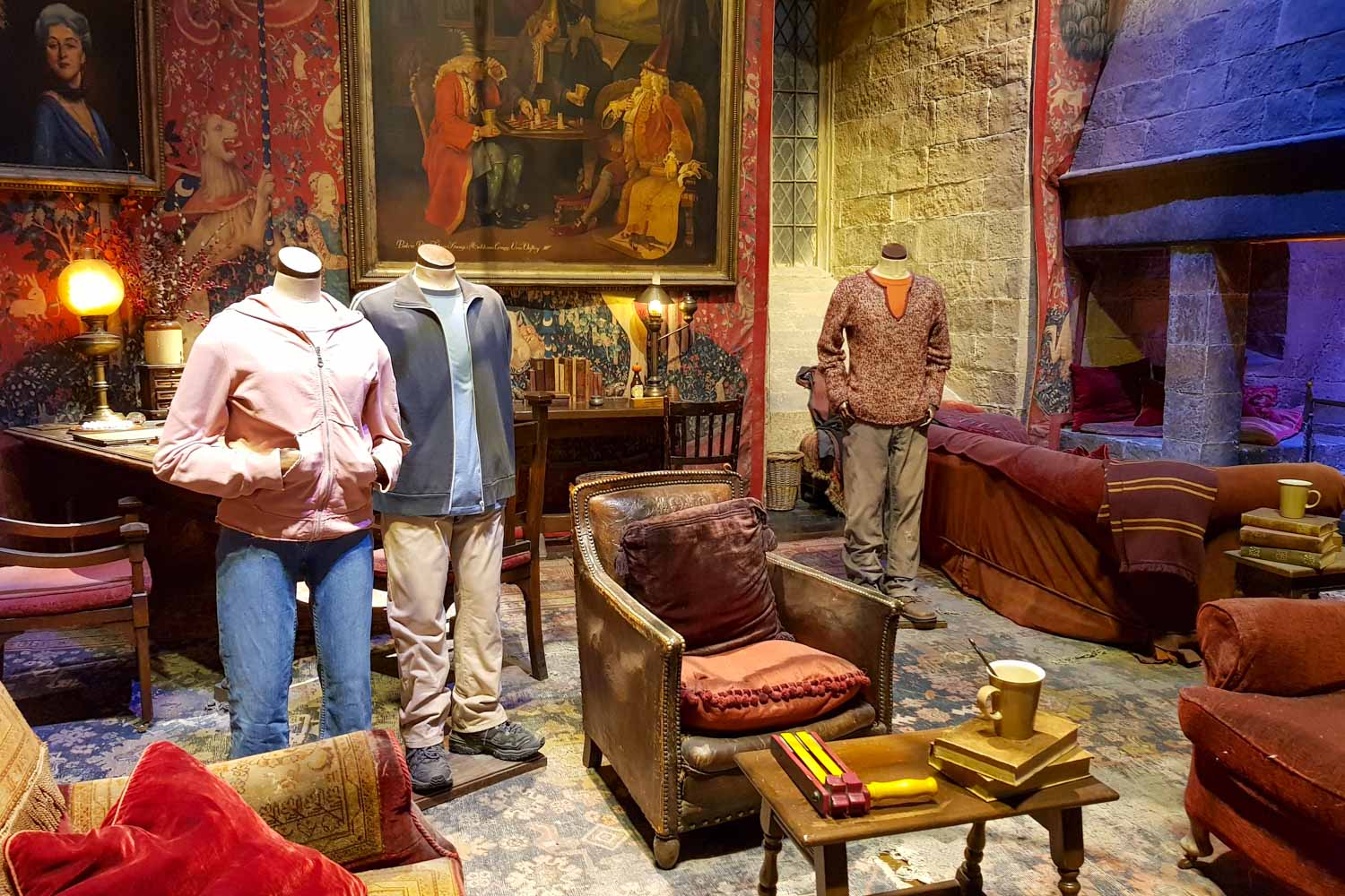 The Gryffindor common room set with models dressed in outfits for Hermione, Harry and Ron at the Warner Bros Studio tour in Leavesden - my tips for Harry Potter Studio tour, London