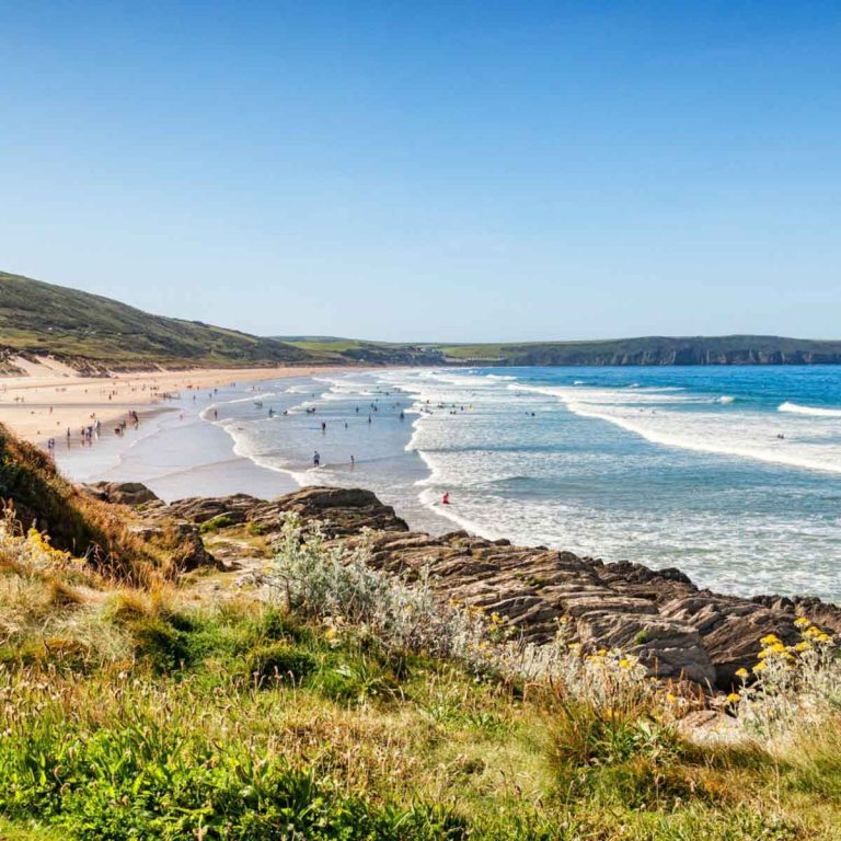 View of the sand at Woolacombe Bay in Devon - heading to the beach is one of the top free days out in Devon with kids