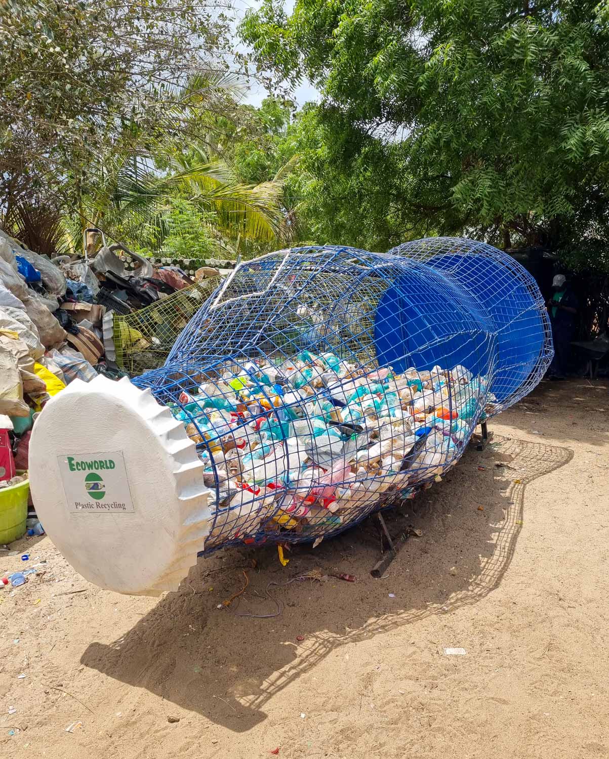Giant mesh bottle designed to collect used plastic bottles at Ecoworld Watamu in Kenya - one of the important initiatives to visit in Watamu with kids