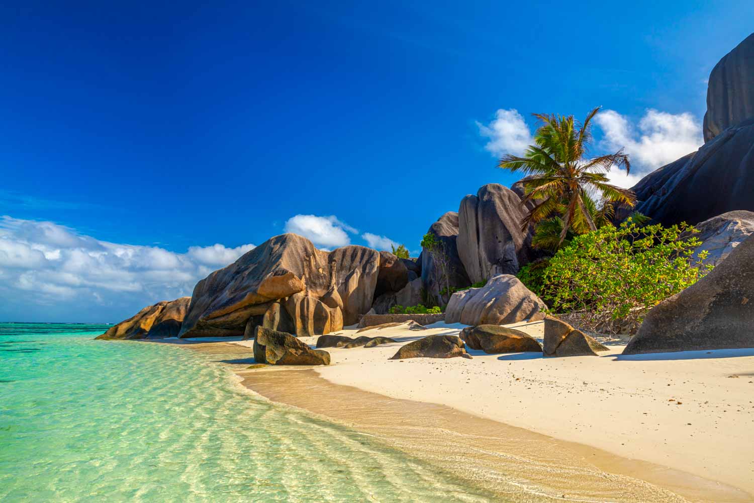 Anse Source D'Argent on La Digue island, one of the most beautiful beaches in the Seychelles - while winter is rainy season, it's still a great option for winter sun with kids