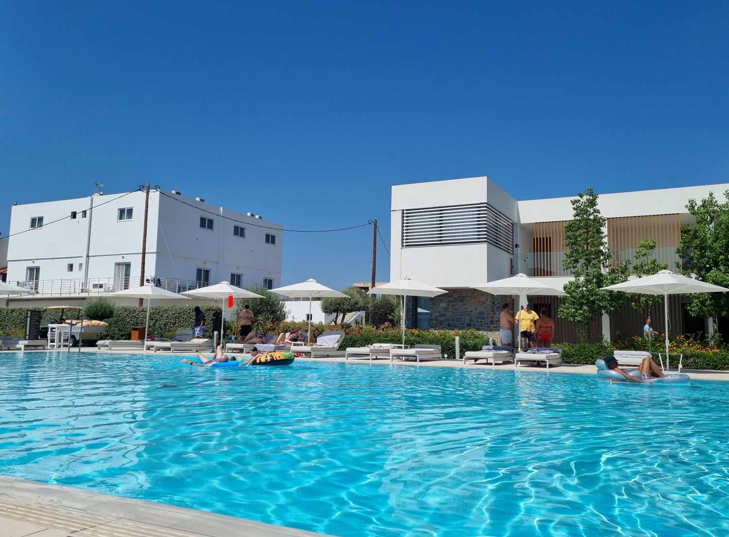 View across one of the smaller pools to a string of loungers in Gennadi Grand Resort - my review