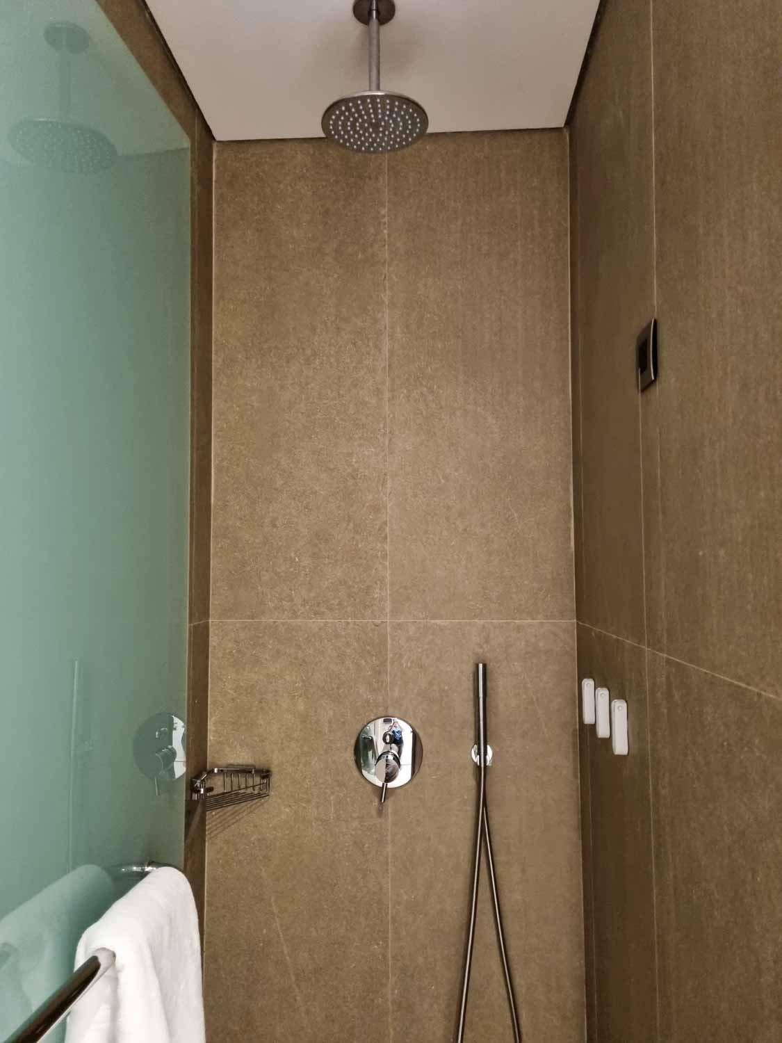 View of the rainhead shower cubicle in the bathroom of our junior suit at Gennadi Grand resort - my Gennadi Grand review of a family-friendly hotel in Rhodes