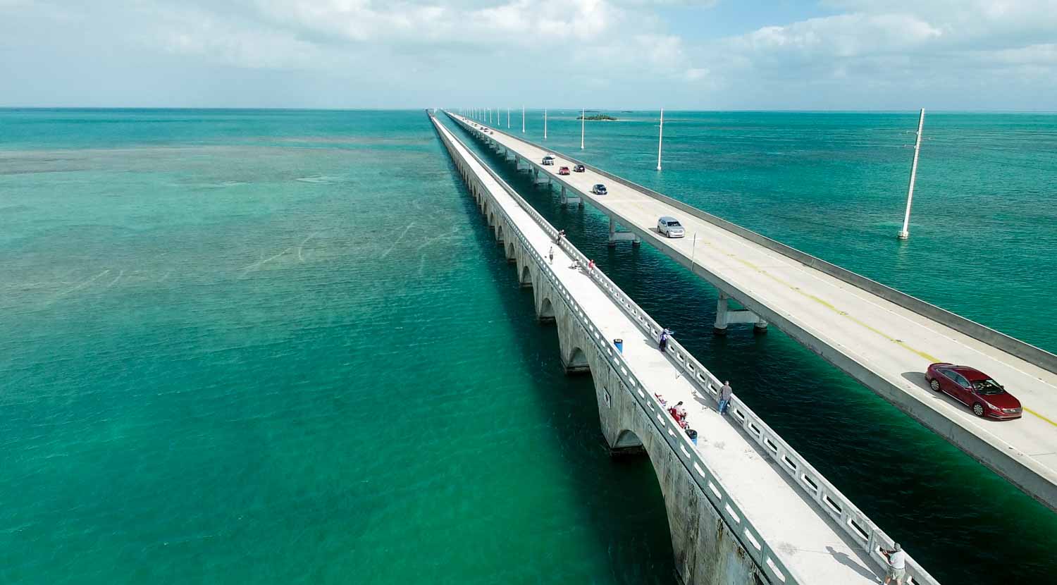 Aerial view of the bridge connecting the Florida Keys - the Overseas Highway is a memorable drive but best to plan your trip to avoid traffic during your Florida Keys road trip