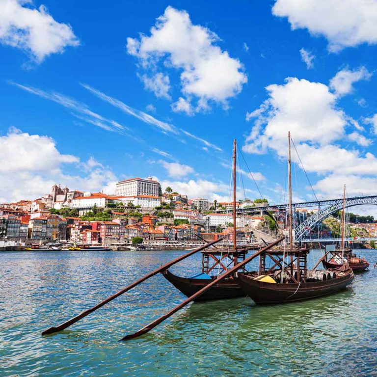 Traditional boats on the Douro river in Porto - my tips on the best day trips from Porto during a city break in Portugal