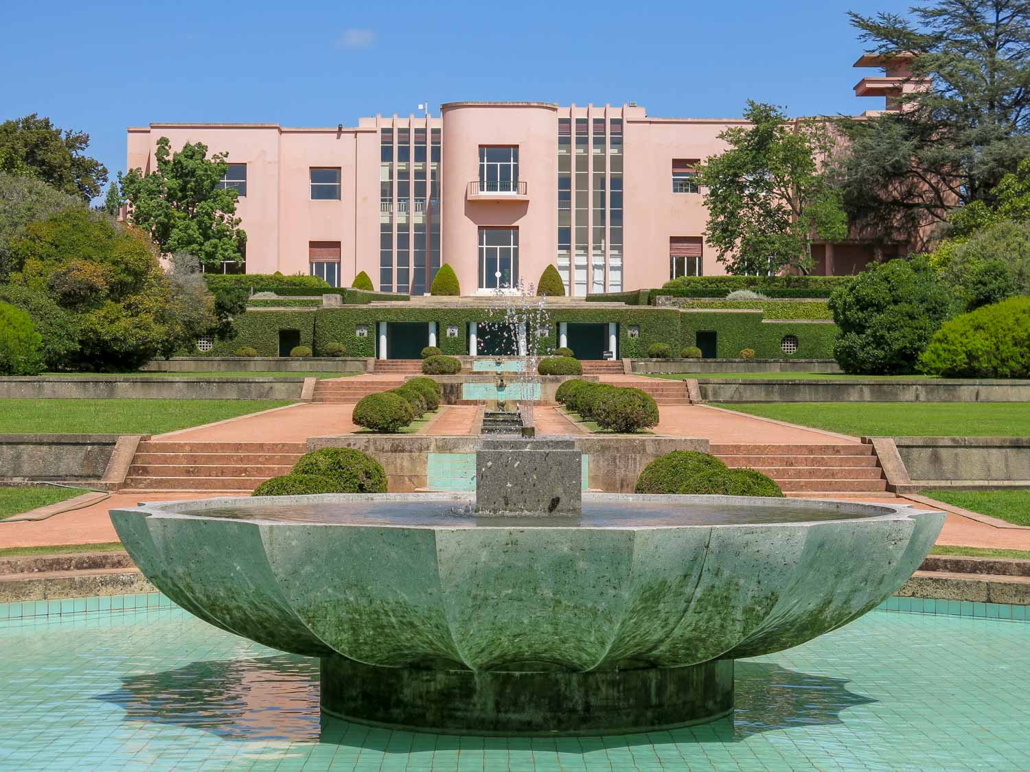 The pink art deco villa and fountain in the Serralves Gardens - visiting the treetop walkway and modern art museum are some of the more unusual things to do in Porto with kids