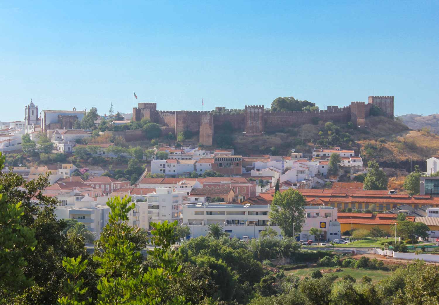 A view up to Silves Castle in the Algarve, Portugal, towering above the town during a family day out
