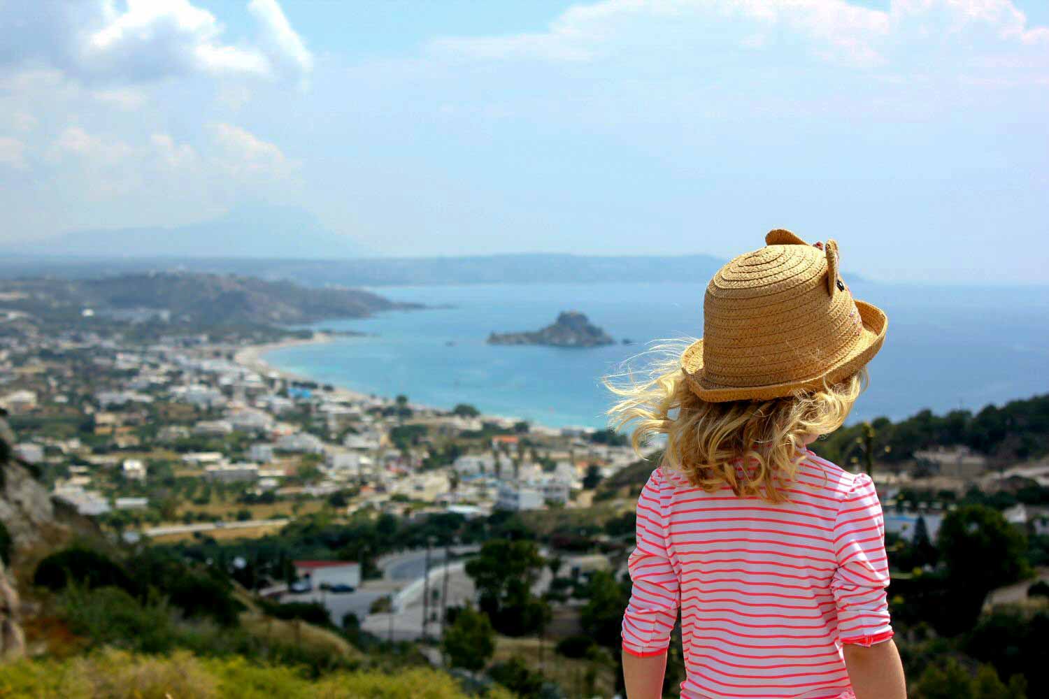 My daughter looks out to the Aegean from the viewpoint in Kefalos old town - with a few days on the island, I found 11 things to do in Kos with kids