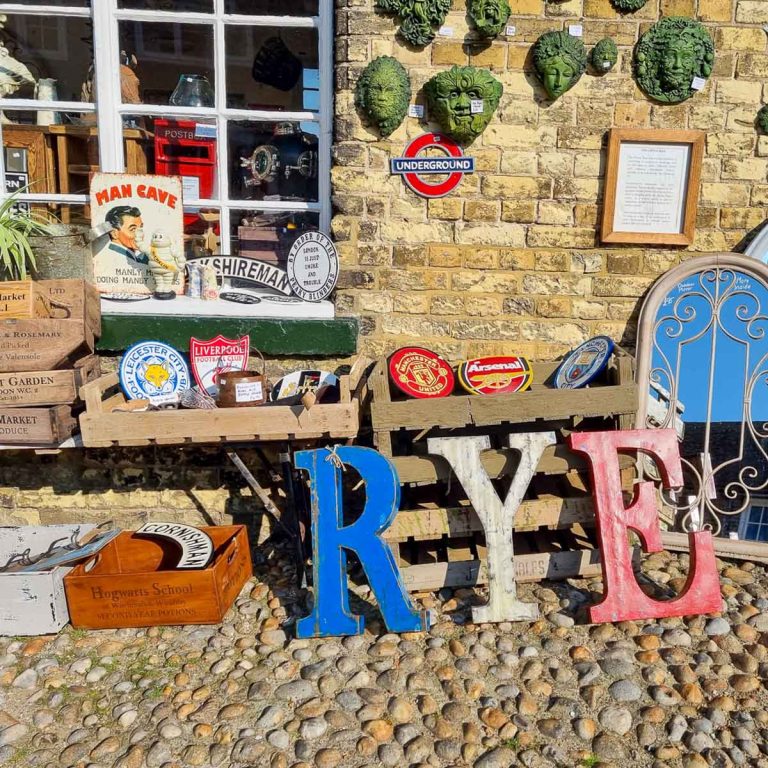 Vintage items on display outside a shop, including letters spelling the word Rye - if you're on holiday in Camber Sands with kids, a visit is unmissable
