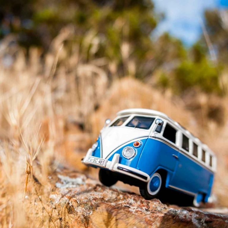 Toy campervan model in a field - my suggestions of how to camp if you hate tents with the best glamping alternatives