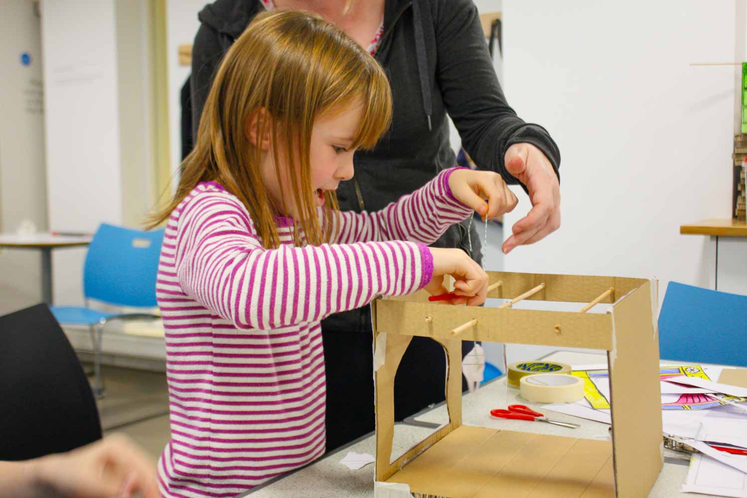 A girl at one of the creative workshops at the Foundling Museum - one of the fun things to do at February half-term in London with kids