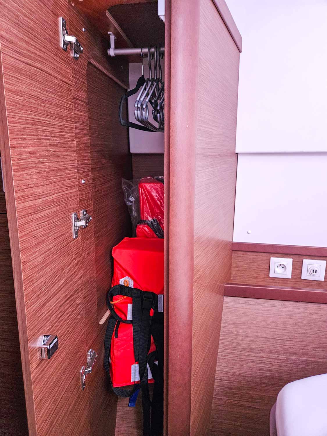 View of some of the storage space filled with life jackets aboard our Lagoon 42 catamaran with plugs just seen - my review of a More Sailing Croatia holiday with kids