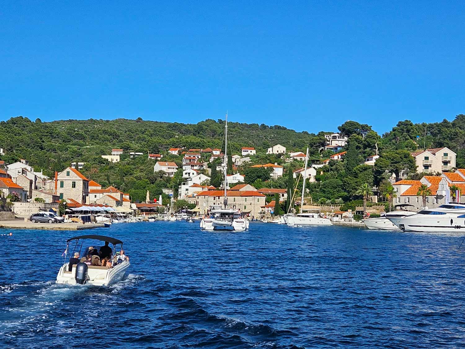 View of the harbour and marina at Maslinica on the island of Solta during a Croatia sailing holiday with kids