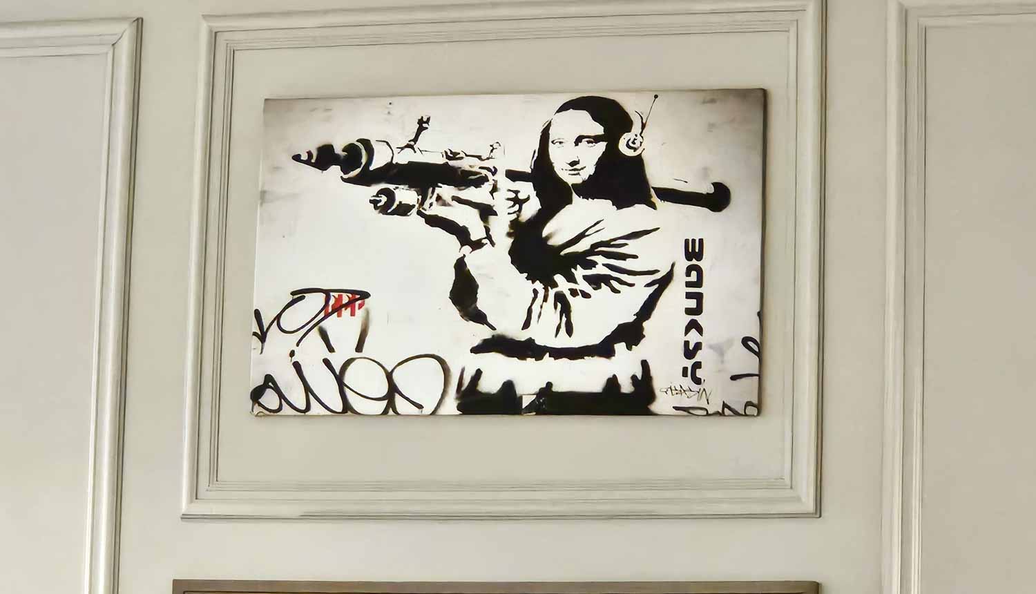 Mona Lisa holding a rocket launcher, some of the artwork in the Jailhouse Bar - my Courthouse Hotel Shoreditch review