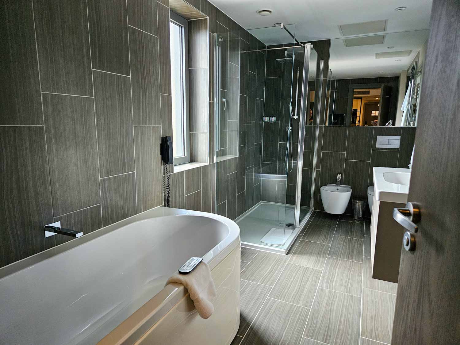 Bathroom in a Hoxton family suite including bath and shower - my Courthouse Hotel Shoreditch review