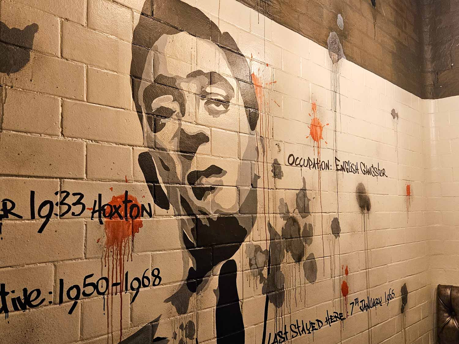 Artowkr of one of the Kray twins inside one of the old cells, now converted to a private dining booth in the Jailhouse bar - my Courthouse Hotel Shoreditch review