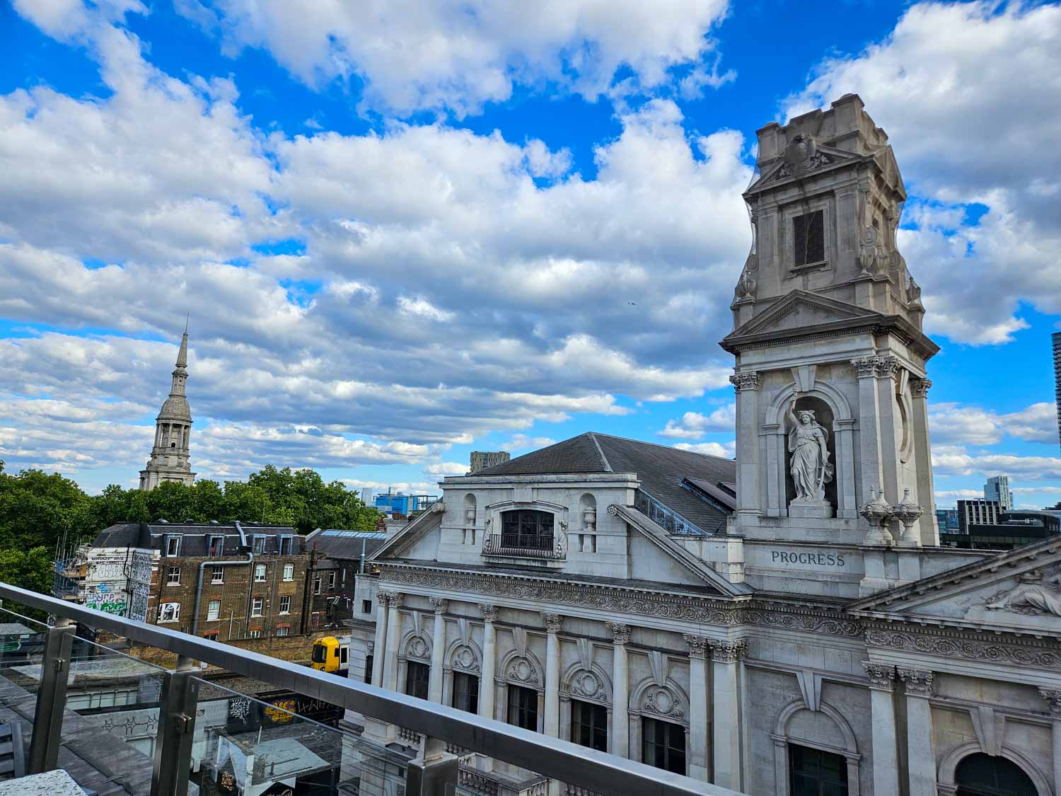 View from the roof terrace bar to St Leonard's church in the distance and Shoreditch town hall - my Courthouse Hotel Shoreditch review