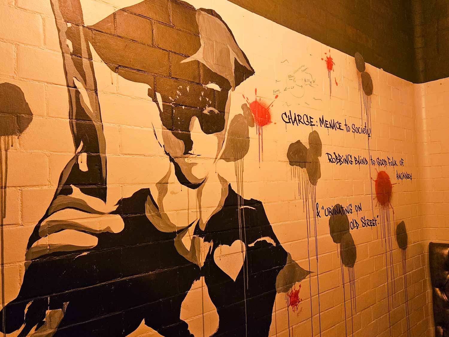 Artwork of Dick Turpin painted on a wall of one of the converted jail cells in the Jailhouse Bar - my Courthouse Hotel Shoreditch review