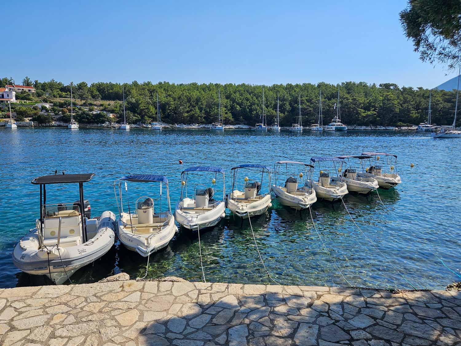Little boats available to hire for short trips - what to do during one day in Fiskardo with kids