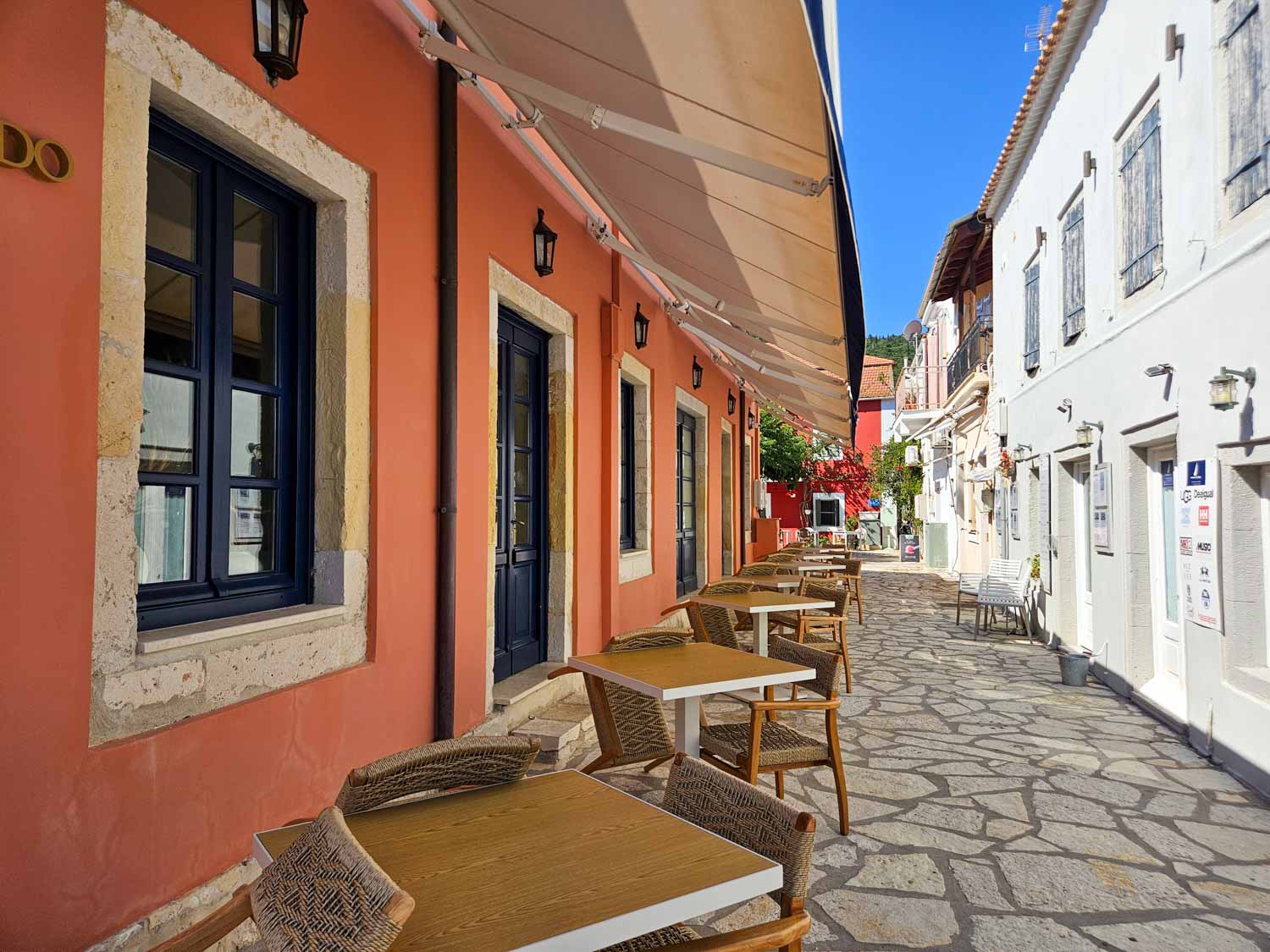 View of some of the colourful painted buildings in the village - what to do during one day in Fiskardo with kids