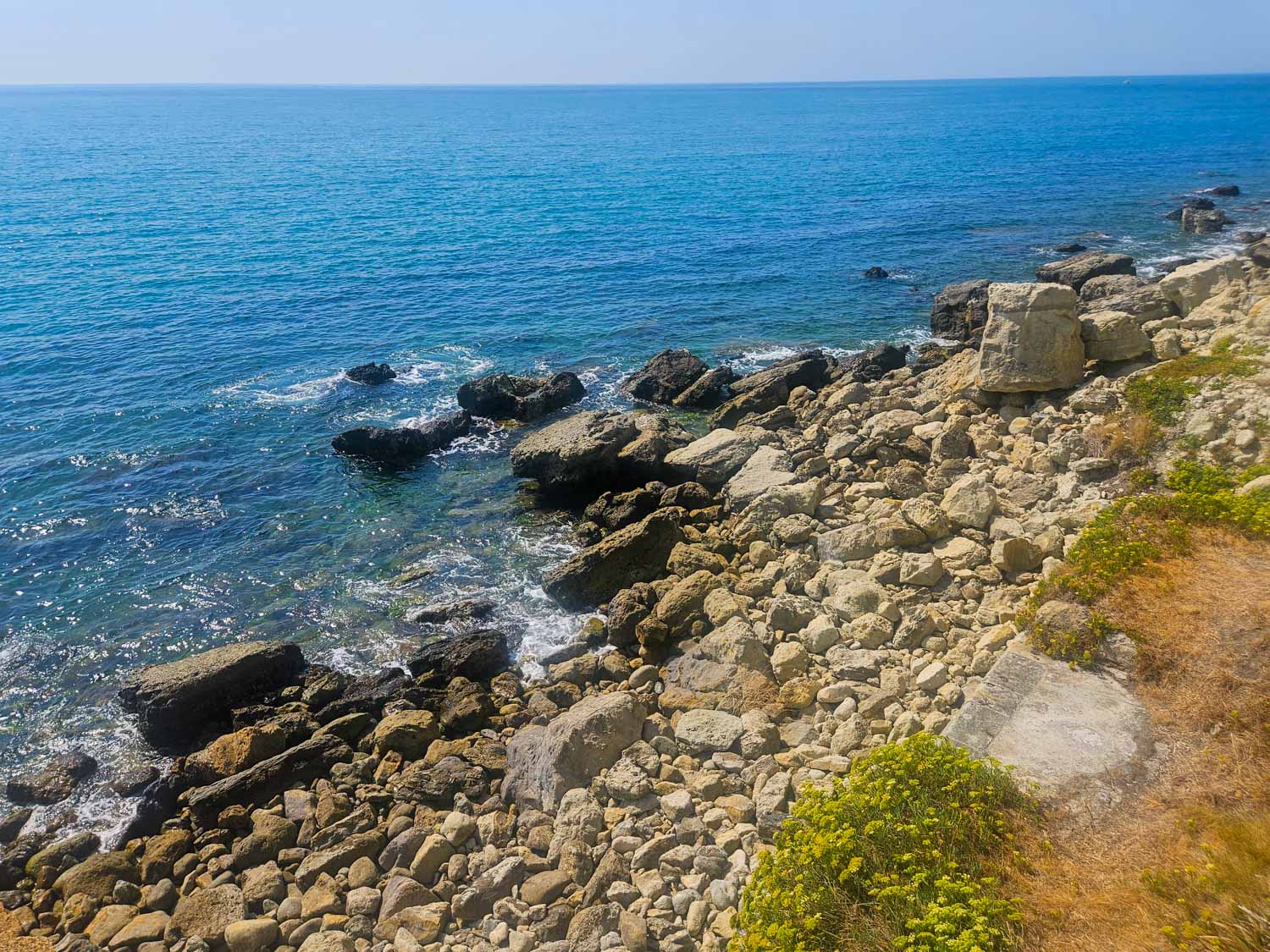 View down onto the sea and rocky coast from the Victorian tunnel at Ventnor Botanic Garden - a visit is one of the best things to do on the Isle of Wight with kids