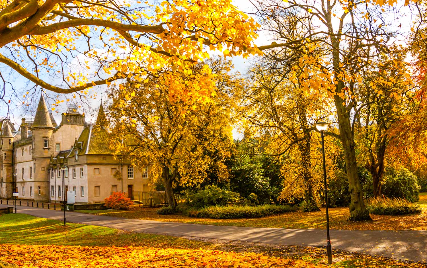 Callendar House and Park in Falkirk in autumn, with golden leaves on the trees - a visit is one of the best things to do in Falkirk with kids