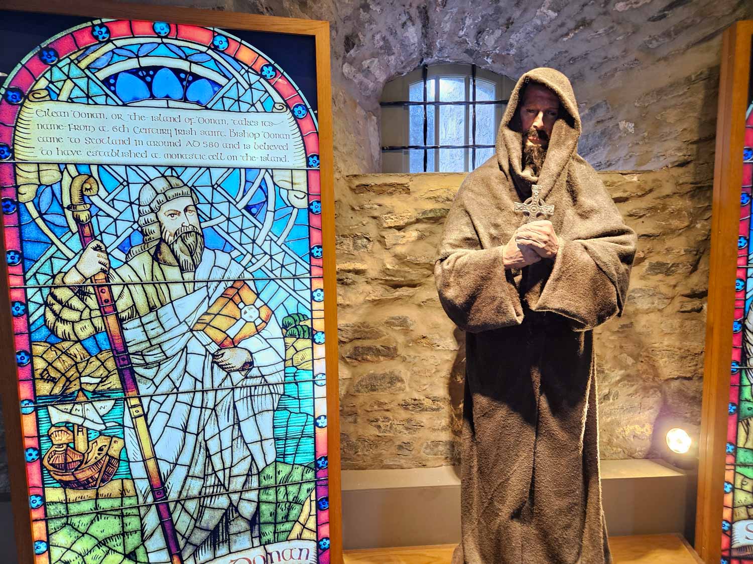 Exhibit in Eilean Donan Castle on the 6th century monk who helped give the place its name - a visit is an easy day trip from the Isle of Skye with kids