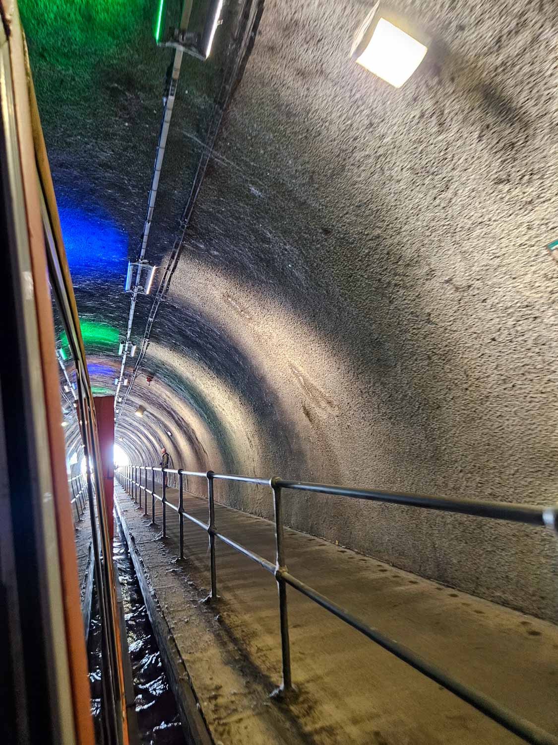Canal tour boat passing through a tunnel on the Falkirk Wheel tour - a visit is one of the best things to do in Falkirk with kids