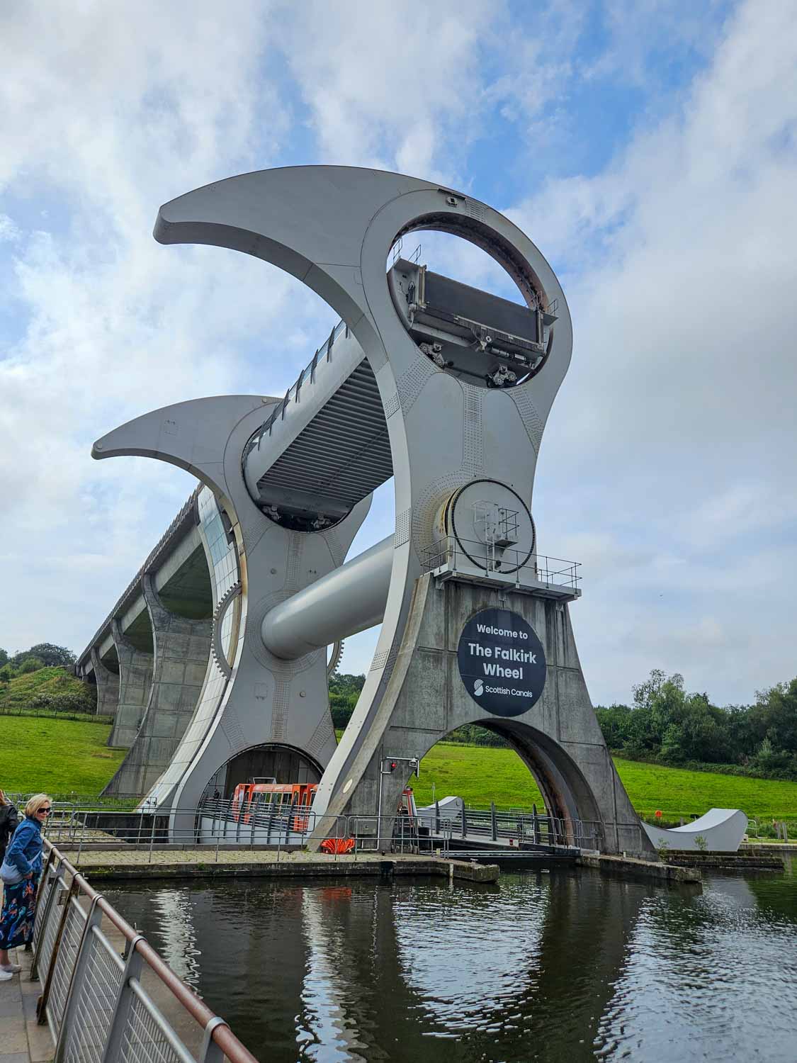 Canal tour boat sailing into the Falkirk Wheel - a visit is one of the best things to do in Falkirk with kids