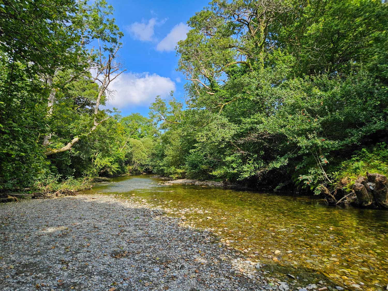 View from the bank along the shallow river at Luss - my pick of the best things to do in Loch Lomond with kids