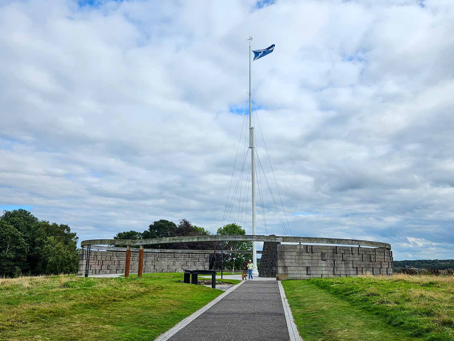 Scottish flag flying at Bannockburn, on the site of the historic battlefield - one of several places to visit in Stirling during a Scotland road trip with kids