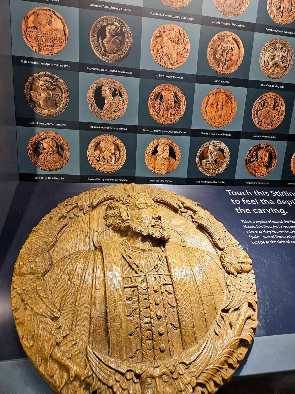 Wooden carving recreating one of the Stirling Heads - a visit to Stirling castle is one of the best things to do in Stirling with kids