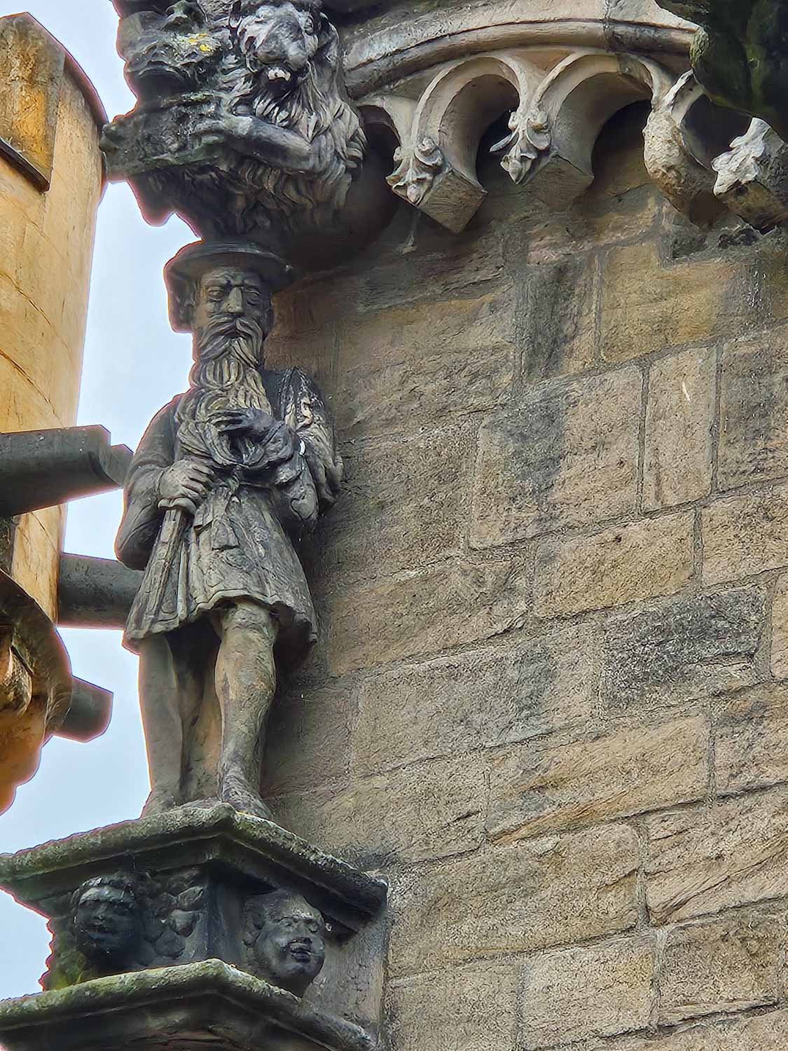 Detailed stone statue of James V who added the palace to Stirling Castle - a visit is one of the best things to do in Stirling with kids