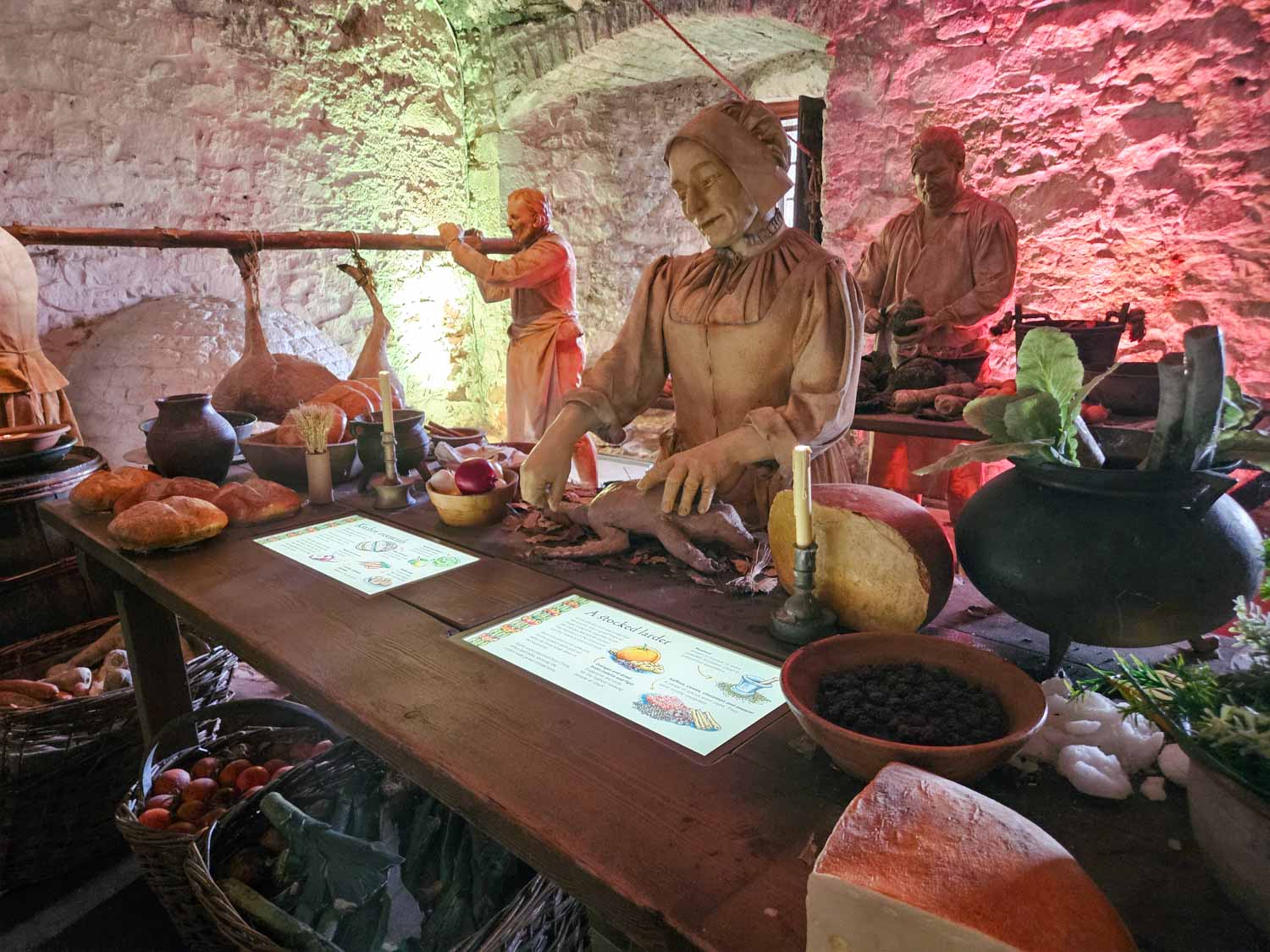 Figures of servants stand hard at work in the kitchens of Stirling Castle - a visit is one of the best things to do in Stirling with kids