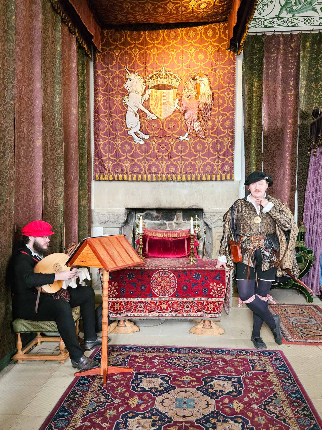 Two actors in costume in the palace royal apartments at Stirling Castle - a visit is one of the best things to do in Stirling with kids