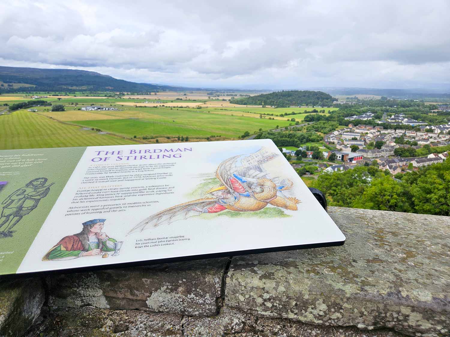 Information board on the birdman of Stirling on the castle walls with the countryside behind - a visit to Stirling Castle is one of the best things to do in Stirling with kids
