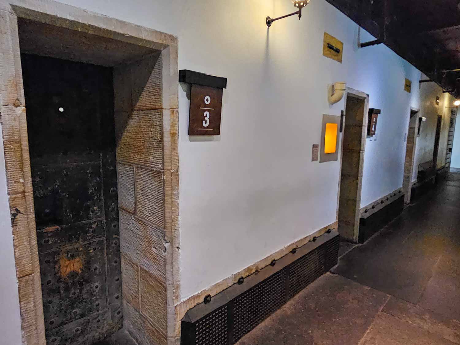 View of the corridor lined with cells at Stirling Old Town jail - a visit is one of the best things to do in Stirling with kids