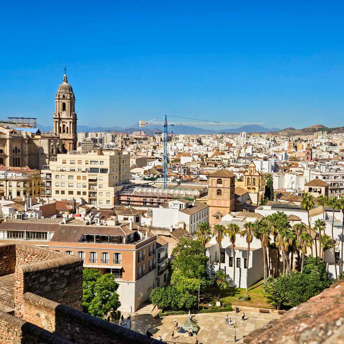 View from the Alcazaba out across the city rooftops and cathedral of Malaga - my tips for the best things to do in Malaga with kids