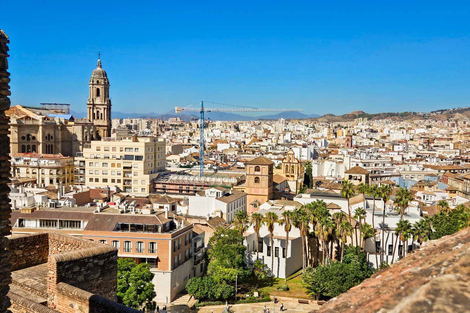 View from the Alcazaba out across the city rooftops and cathedral of Malaga - my tips for the best things to do in Malaga with kids