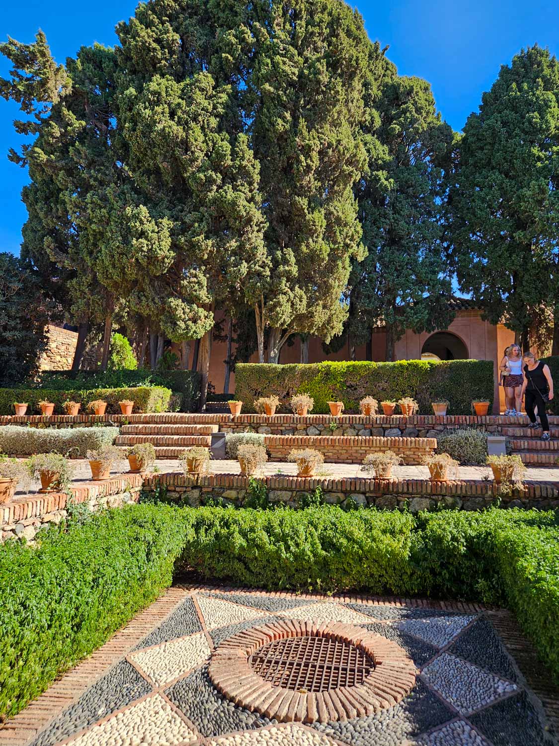 View across a courtyard in the Alcazaba in Malaga - a visit is one of the best things to do in Malaga with kids