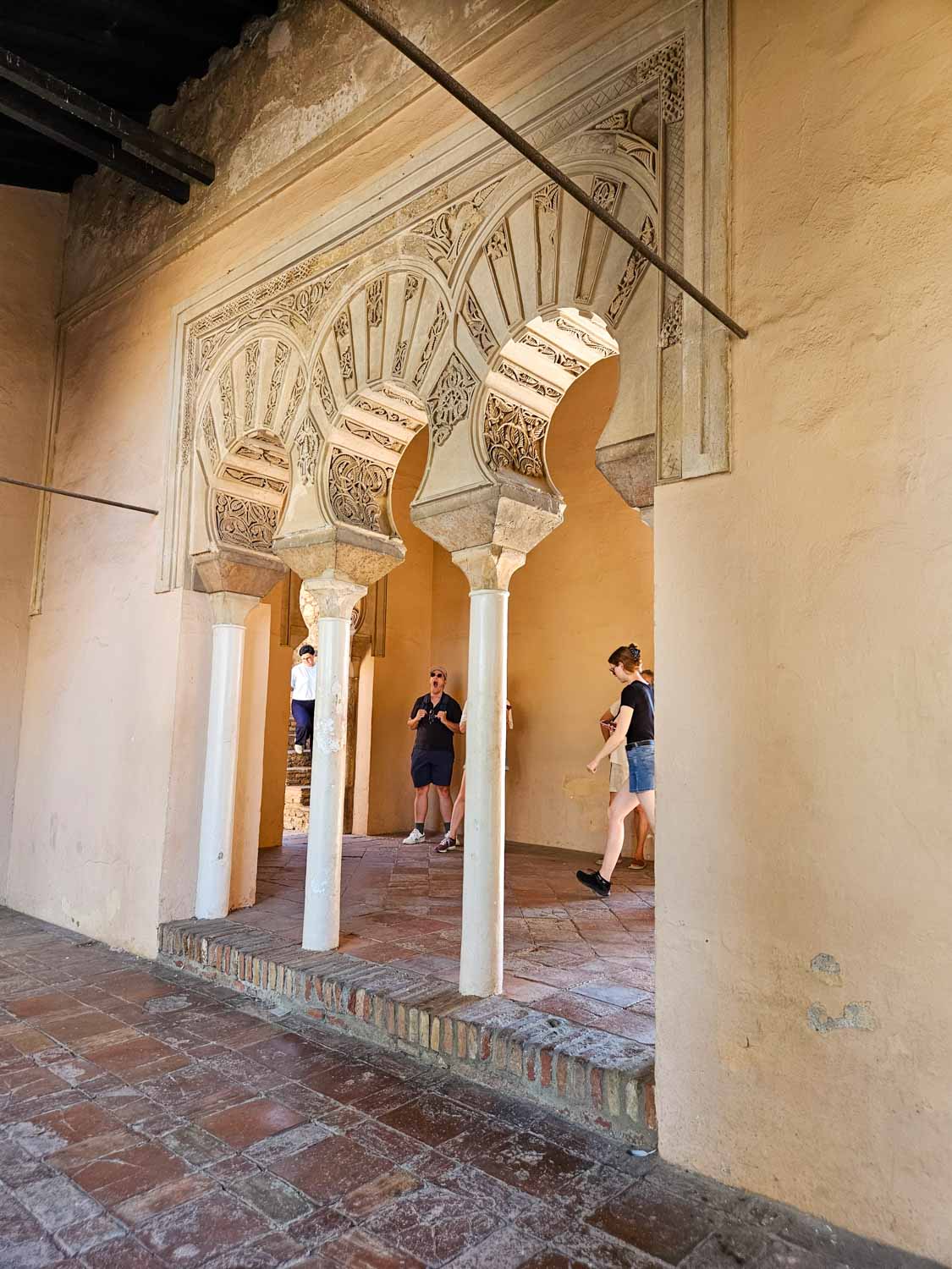 Decorative arches in the palace buildings of the Alcazaba in Malaga - a visit is one of the best things to do in Malaga with kids
