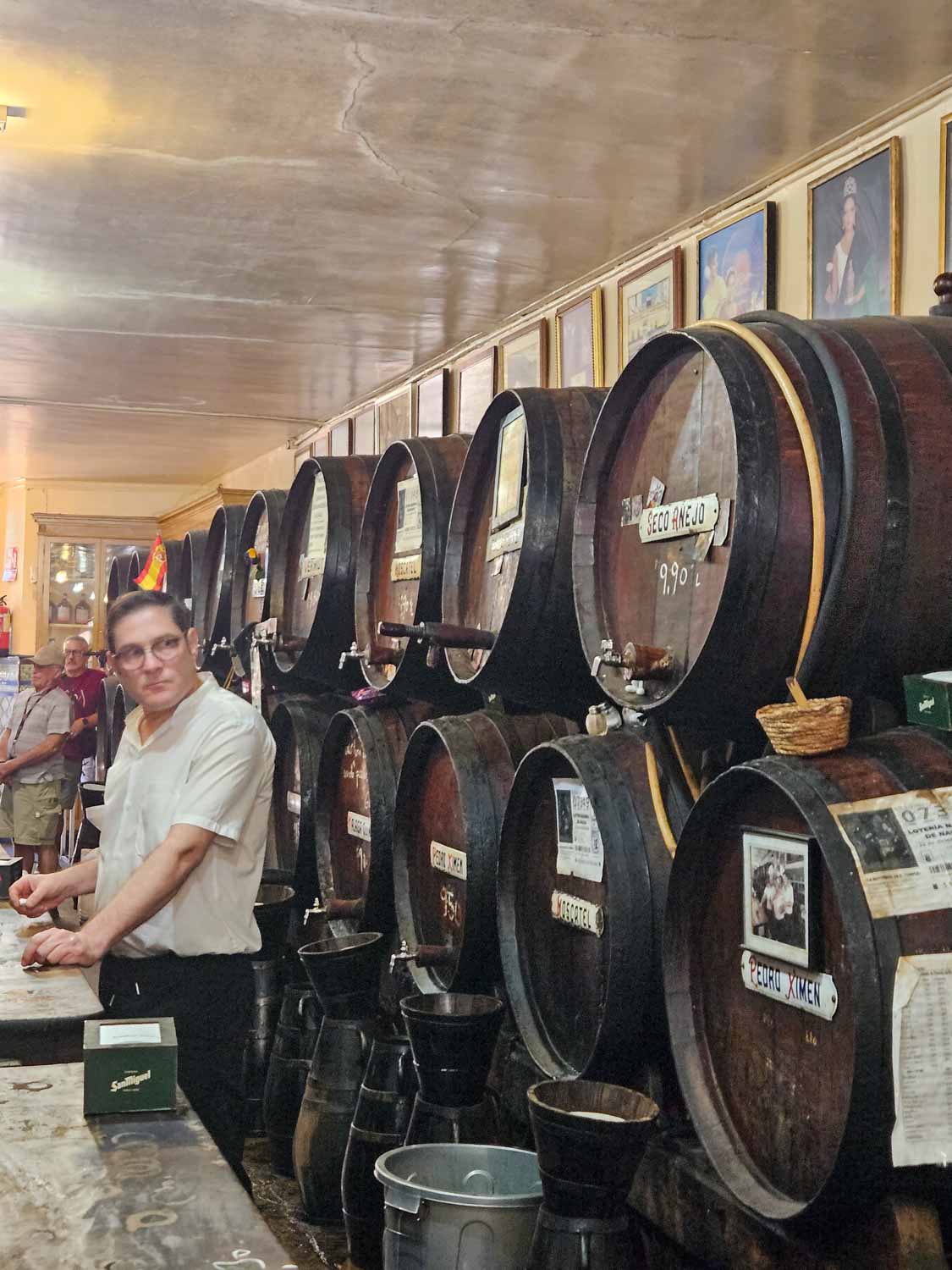 Huge barrels in Malaga's oldest bar, Antigua Casa di Guardia during a tapas tour