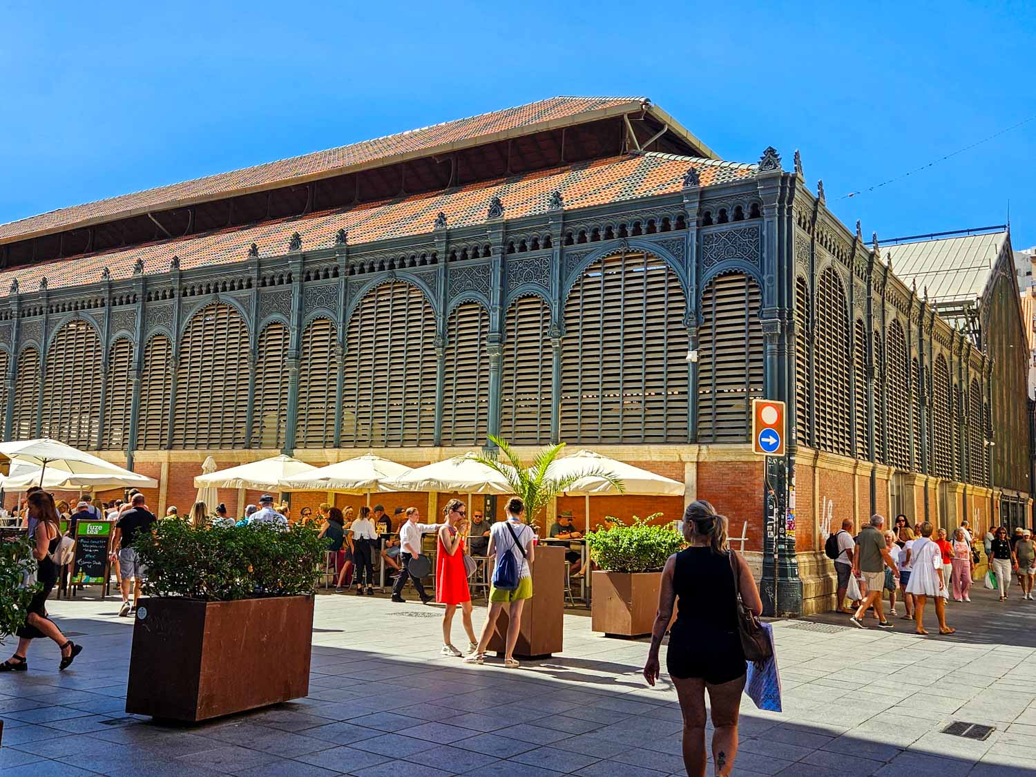 Exterior of the Atarazanas market in Malaga with one of the many tapas bars surrounding it - a visit is one of the best thing to do with kids in Malaga